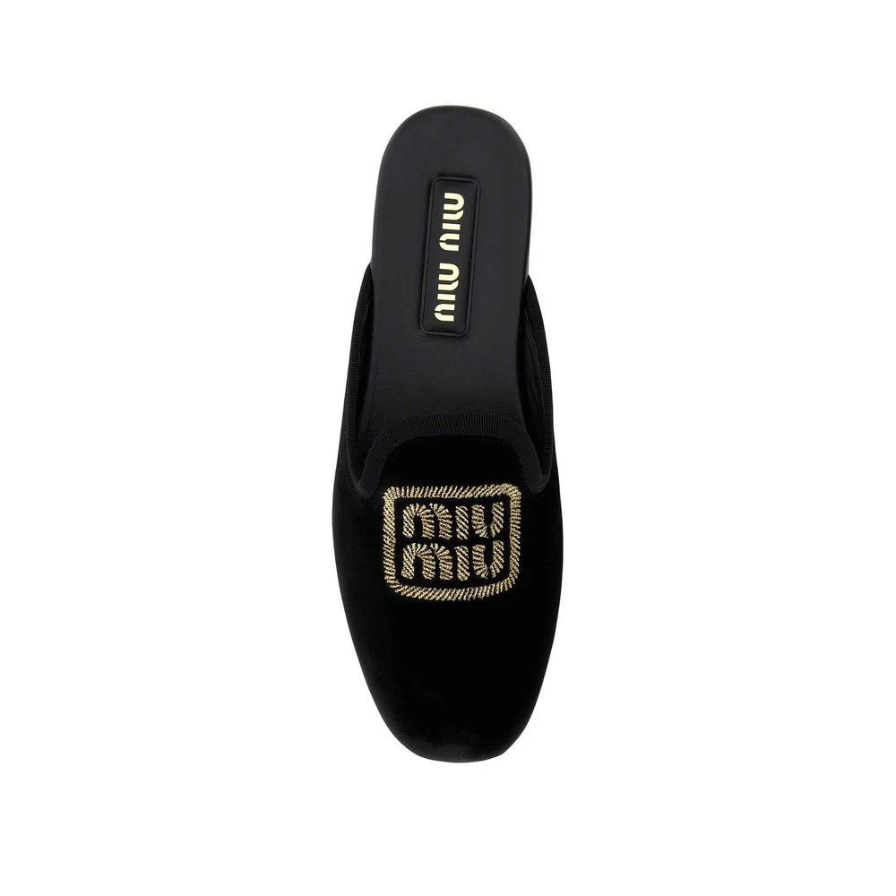 Mules Miu Miu en cuir de veau noir