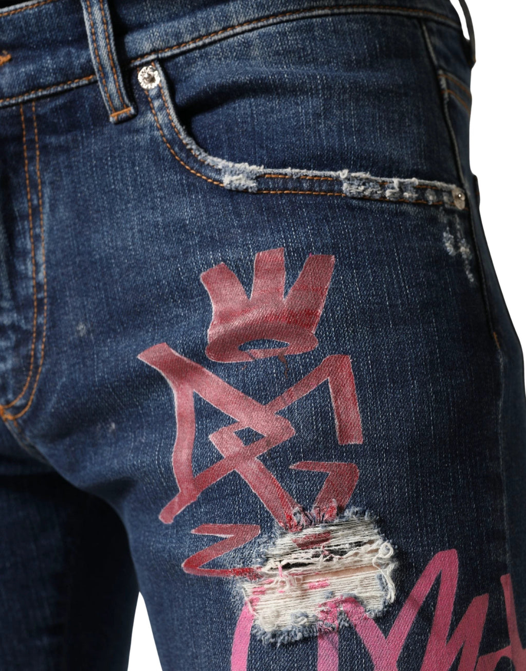 Jean skinny bleu délavé à imprimé graffiti Dolce &amp; Gabbana