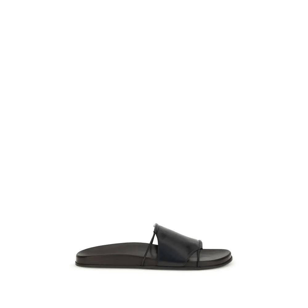 Sandales plates The Row en cuir de veau noir Bos Taurus