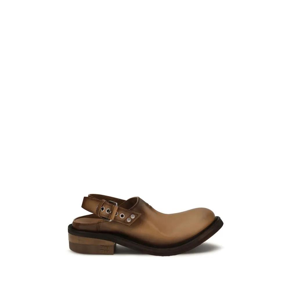 Mules Bos Taurus en cuir de veau marron Miu Miu