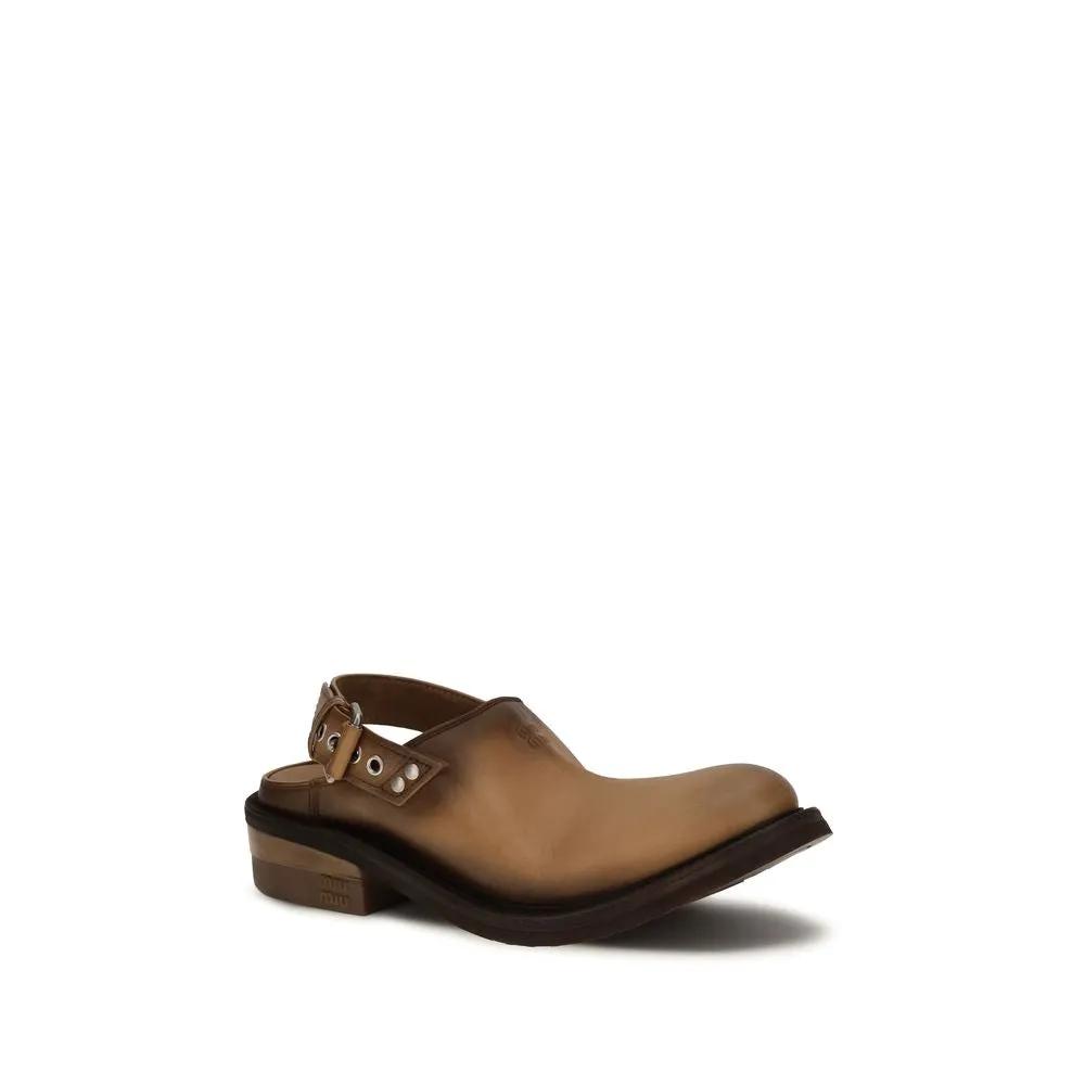 Mules Bos Taurus en cuir de veau marron Miu Miu