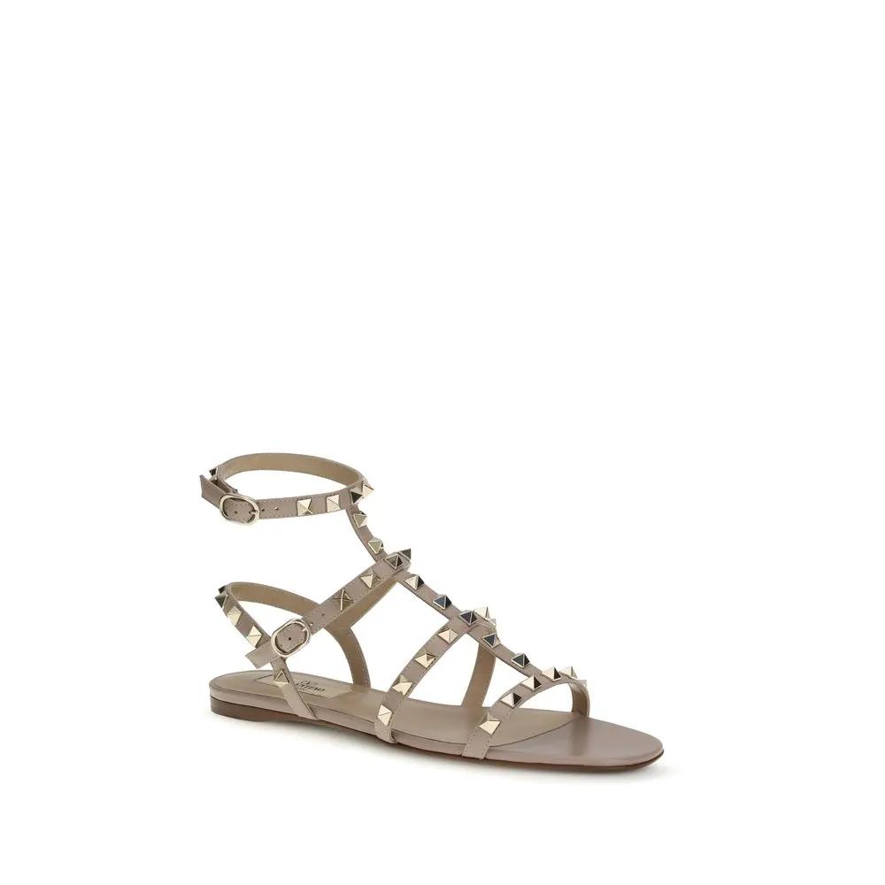 Valentino Garavani Sandales plates en cuir de veau rose Bos Taurus