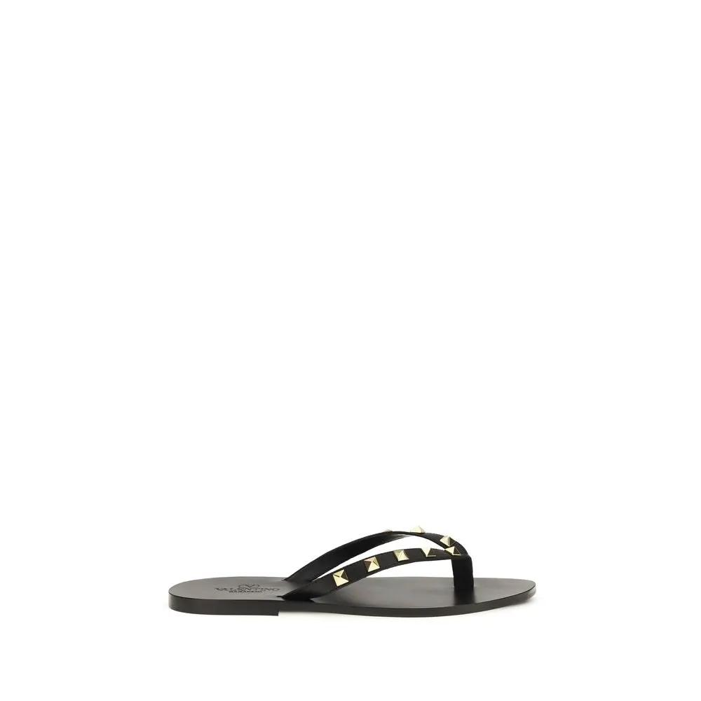 Valentino Garavani Sandales tongs en cuir de veau noir Bos Taurus