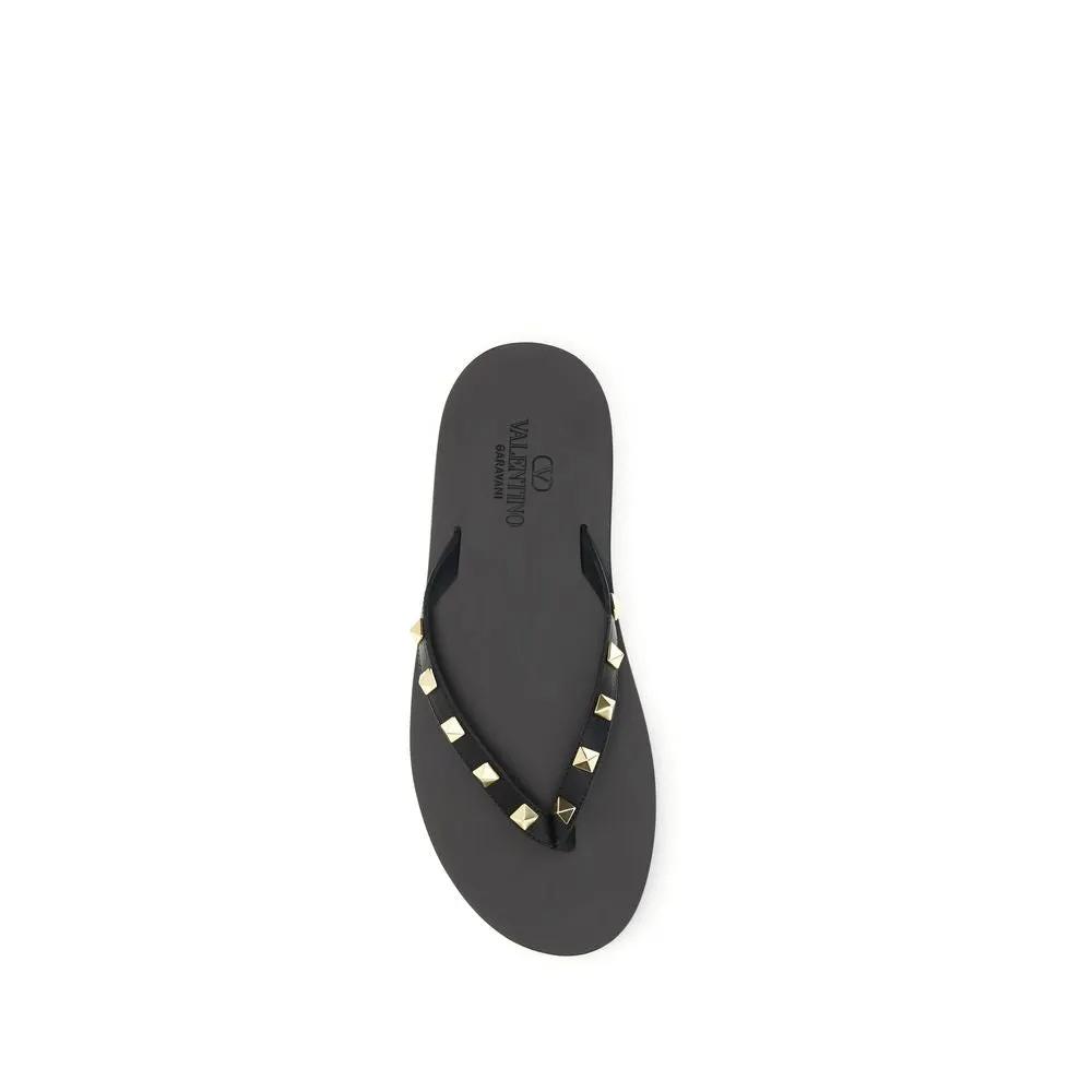 Valentino Garavani Sandales tongs en cuir de veau noir Bos Taurus