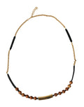 Pendentif Dolce &amp; Gabbana en bois et perles noires et dorées avec logo