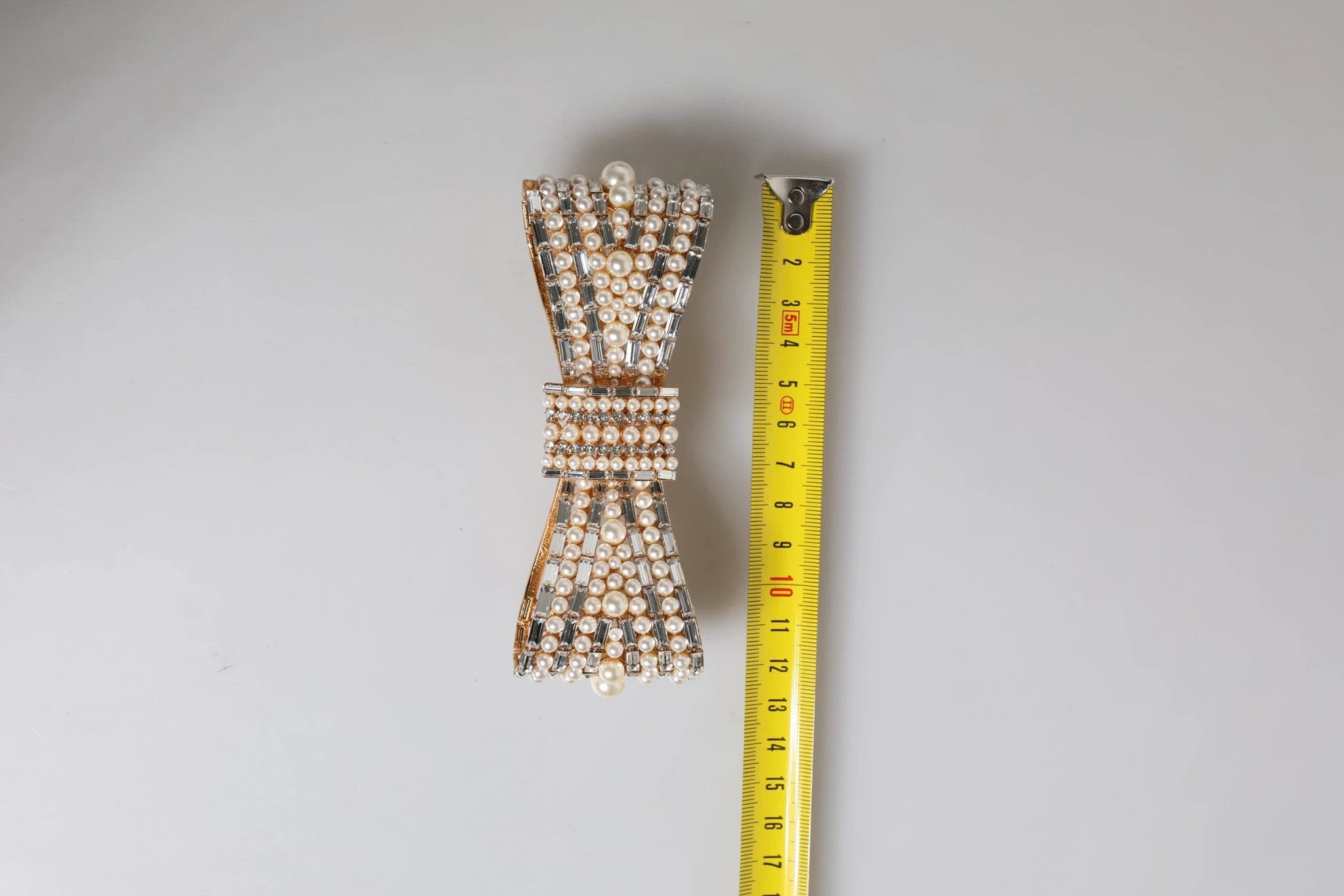 Dolce & Gabbana Gold Tone Brass Bow Crystal FauxPearl Embellished Brooch by Dolce & Gabbana