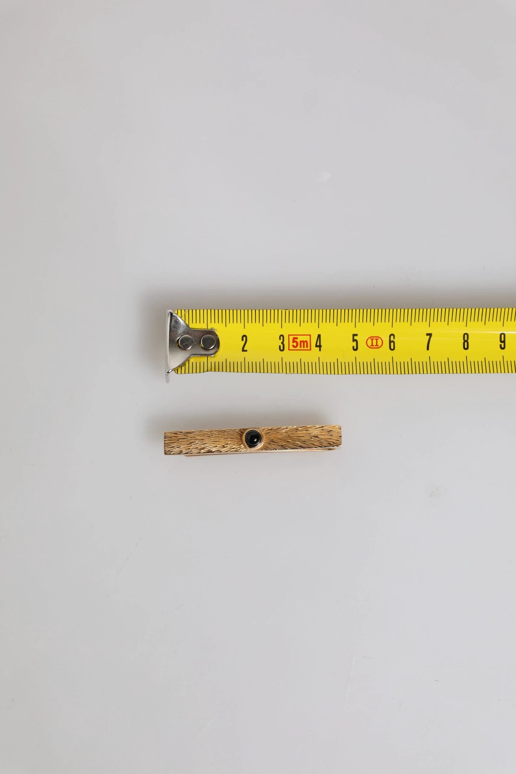 Dolce & Gabbana Black Sapphire Gold Tone Brass Tie Clip Bar by Dolce & Gabbana