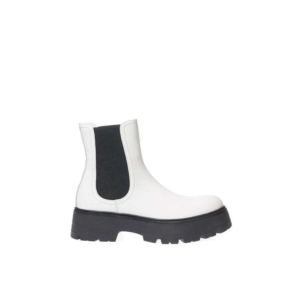 Alexander McQueen white brushed leather Chelsea boots with black elastic sides, tonal topstitching and oversized flared sole.